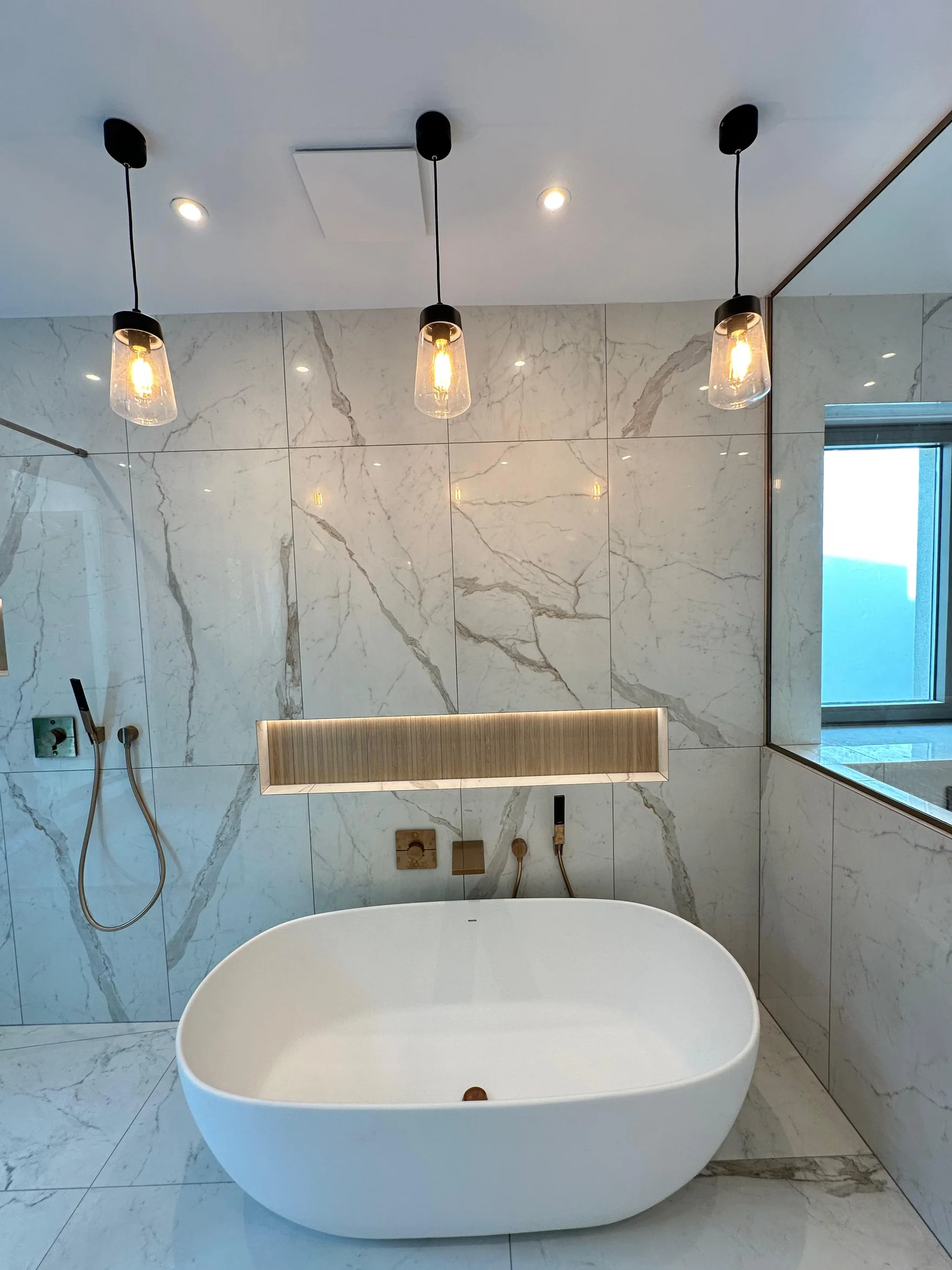 Completed bath installation and tiling