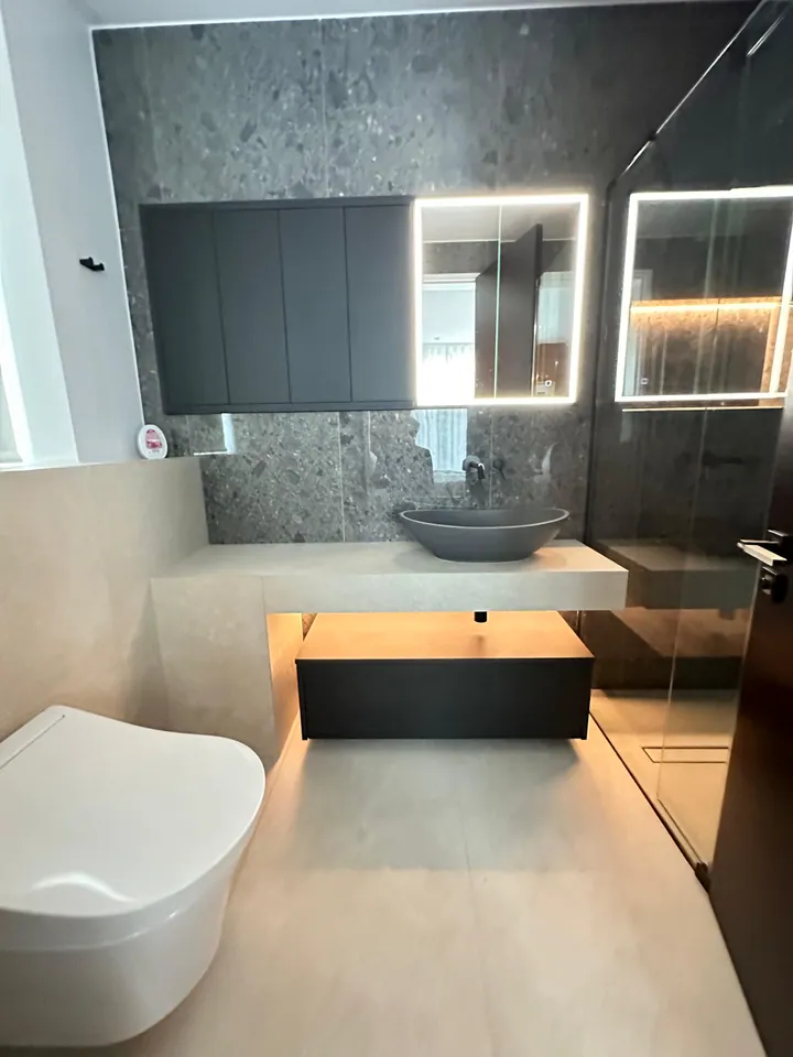 Custom vanity with backlit mirror