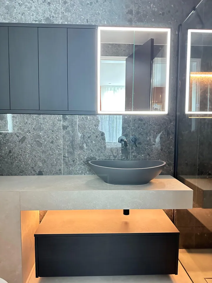 Floating vanity with concealed light strip