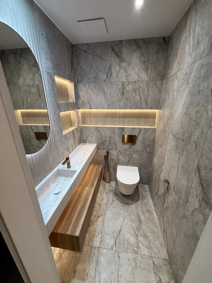 Layered lighting and bespoke vanity details